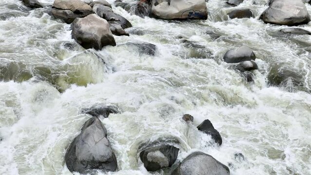 Aerial shot of river rapids on the Kern River in the Southern Sierra Nevada Mountains in California. Slow Motion.