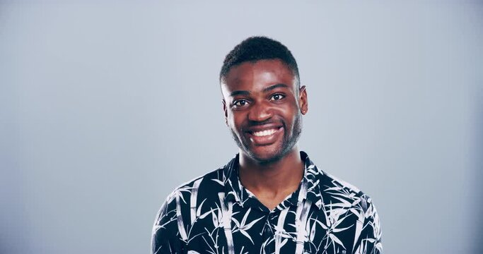 Face, fashion and peace sign with an african man in studio isolated on gray background for freedom. Portrait, smile or hand gesture of a v emoji and a happy black person feeling excited with energy