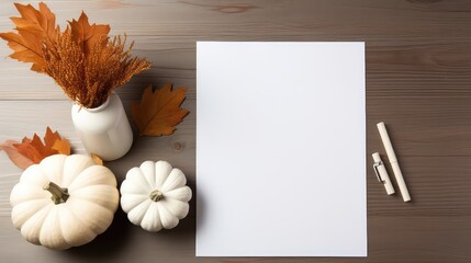 Empty white   paper on a wooden table from top, flatlay, pumpkins and pale  decoration