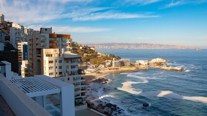 view of the city at sunset Cochoa beach Reñaca beach Viña del Mar Valparaíso Chile  The Garden City - Powered by Adobe