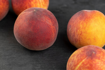 ripe delicious and fresh peaches of a red hue