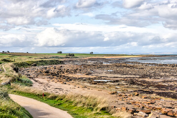 Fototapeta na wymiar St Andrews, Scotland - September 21, 2023: Seaside views alongside the Kingsbarns Golf Course on the outskirts of St Andrews Scotland 