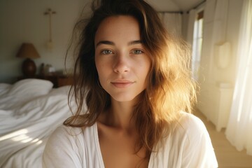 Beautiful Woman Captures Sunrise Selfie in Cozy Bedroom