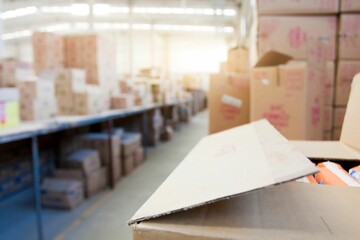 Fototapeta na wymiar Close-up shot of cardboard boxes in a warehouse