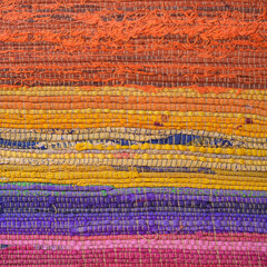 Obraz premium Detail in the colorful patterns of a rag rug