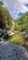 Fototapeta na wymiar hike to Stuibenfall highest waterfall in Tyrol is the 159-meter-high Stuibenfall. It dazzles passers-by with its enormous water amount. An exciting point during the trail is an 80-meter-long steel su