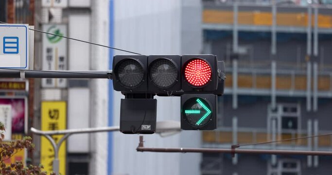 Traffic Light Changing Lights Green Yellow Red and Arrow Turn Right. Tokyo, Japan