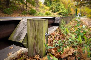 Wooden road guardrail post close-up view, Brighton, USA