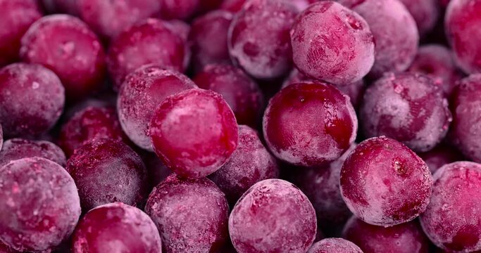 to be covered with frost red cherry covered with a thin layer of ice, frozen for long-term storage ripe red cherry