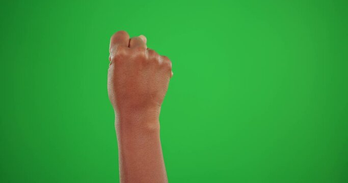 Hand, green screen and sign language with a person in studio for communication or disability awareness. Deaf, fist and arm with an adult on chromakey mockup to signal for interactive linguistics
