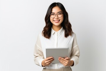 Image of young asian woman company worker in glasses smiling and holding digital tablet standing over white background, generative ai - obrazy, fototapety, plakaty