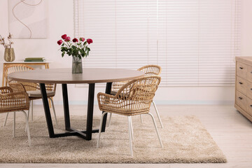 Stylish dining room interior with comfortable furniture. Space for text