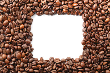Frame of roasted coffee beans on white background, top view