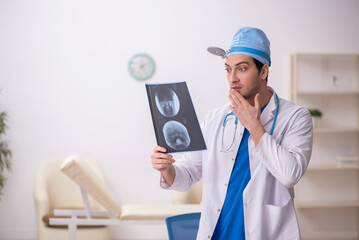 Young male doctor radiologist working in the clinic