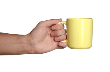 Man holding yellow mug on white background, closeup