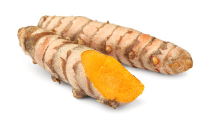 Fresh whole and cut turmeric roots isolated on white
