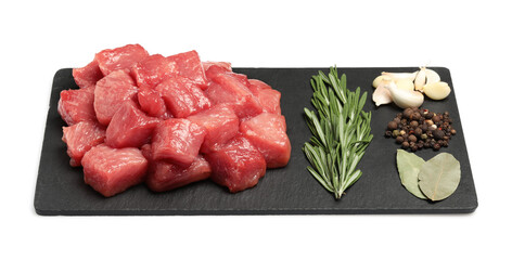 Pieces of raw beef, bay leaves, garlic, rosemary and peppercorns isolated on white