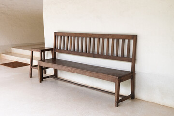 Wooden bench in modern hotel and minimal wall with free text space, Urban benches. - Powered by Adobe