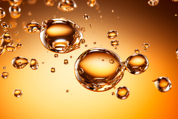 Gold skincare drops: Serum droplet with air bubbles on a white background.  Bright image. 