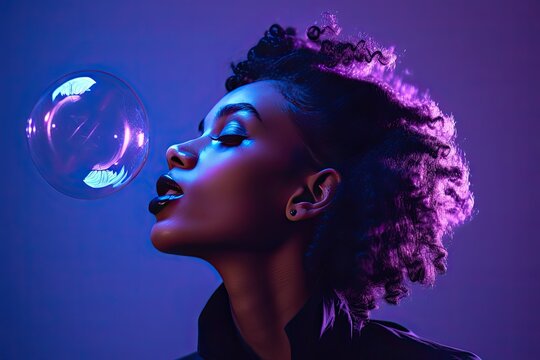 woman with colorful hair blowing a bubble.