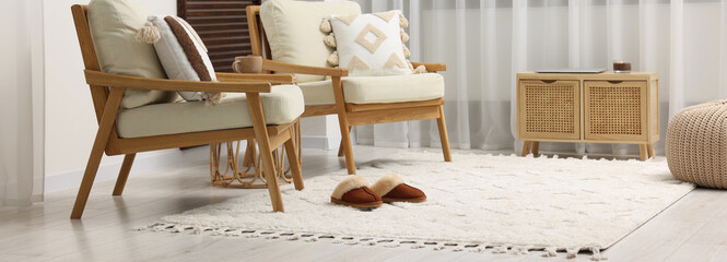 Fototapeta na wymiar Stylish living room interior with soft white carpet and furniture. Banner design