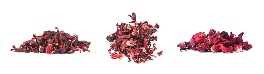 Piles of dry hibiscus tea isolated on white, set