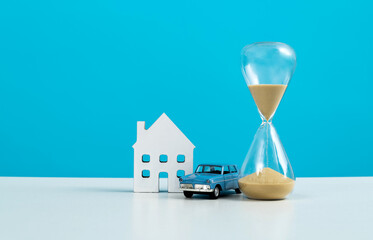 House and car model with hourglass