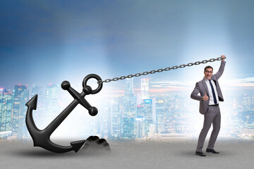 Businessman with anchor in business concept