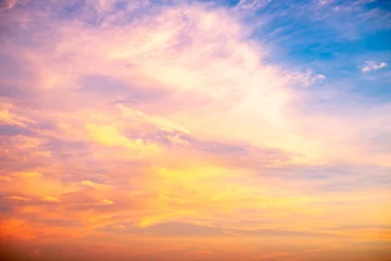 Fototapeten Real amazing Beautiful sunrise and luxury soft gradient orange gold clouds with sunlight on the blue sky perfect for the background, take in everning, Twilight sunset sky with gentle colorful clouds © ISENGARD