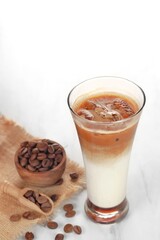 black ice coffee and ice latte coffee with milk in tall glass isolated on white and black background