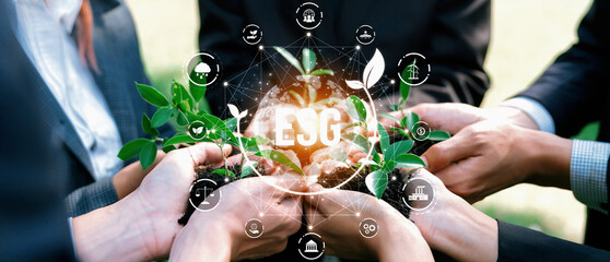 Business partnership leader gather to nurture young seedling plant with ESG icons, symbolizing...