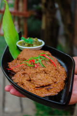 Beef Rendang is a Minang dish originating from the Minangkabau region in West Sumatra, Indonesia. Rendang has been slow cooked and braised in a coconut milk seasoned with a herb and spice mixture