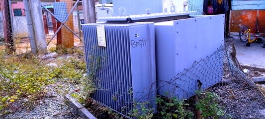 High voltage transformer supplying power to homes.