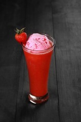 Strawberry juice with ice cream is served in a very luxurious clear glass. isolated in white and dark background