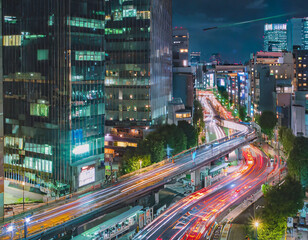 A night timelapse of traffic jam at the bus rotary of the downtown in Tokyo wide
