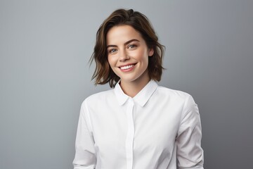 photo of a young woman wearing a white shirt and smiling looking at the camera, one color background, generative ai