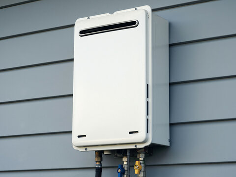 Modern external continuous flow gas water heater mounted on house wall
