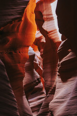 Antelope Slot Canyon in Page, Arizona. Abstract vertical shot of shadows and sunlight in canyon.