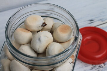 Indonesian snack called ndok bulus in a jar on a the table