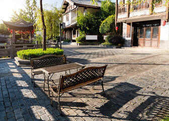 Empty benches on ancient town street