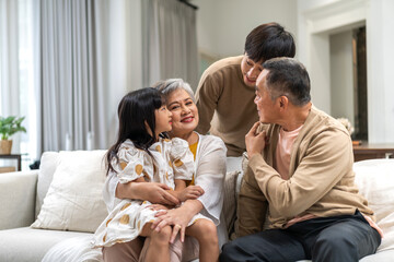 Portrait of happy love family asian father and mother playing with adorable asian kid girl.daughter, care, insurance.Happy family moments good time love with grandparents.Love of big family