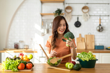 Portrait of beauty body slim healthy asian woman eating vegan food healthy with fresh vegetable...