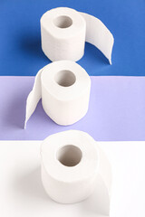 Rolls of toilet paper on colorful background