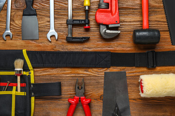 Set of construction tools on wooden background