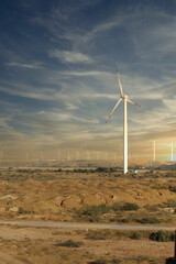 wind turbines with beautiful sunset sky, zorlu energy wind turbines installed in jhampir near gharo sindh Pakistan. renewable energy, green energy