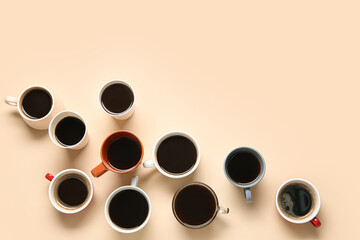 Many cups of hot coffee on beige background