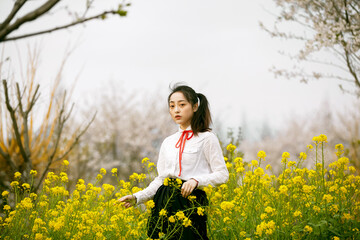 woman in a field of yellow flowers