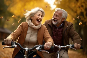 Foto op Canvas happy senior couple riding bicycle in the park © Kien