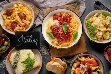 Assortment of Italian pasta with traditional sauces for dinner. Homemade food concept.