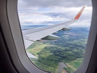 Earth and plane wing view from an illuminator